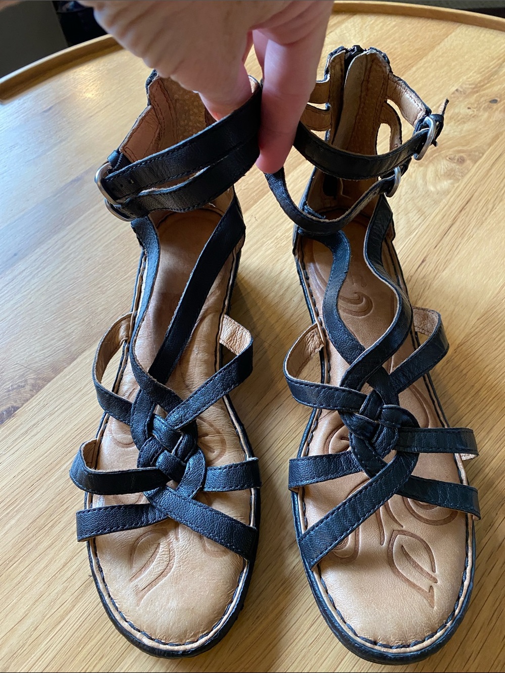 BORN gladiator style leather sandals. Black braided leather straps. Heel zippers